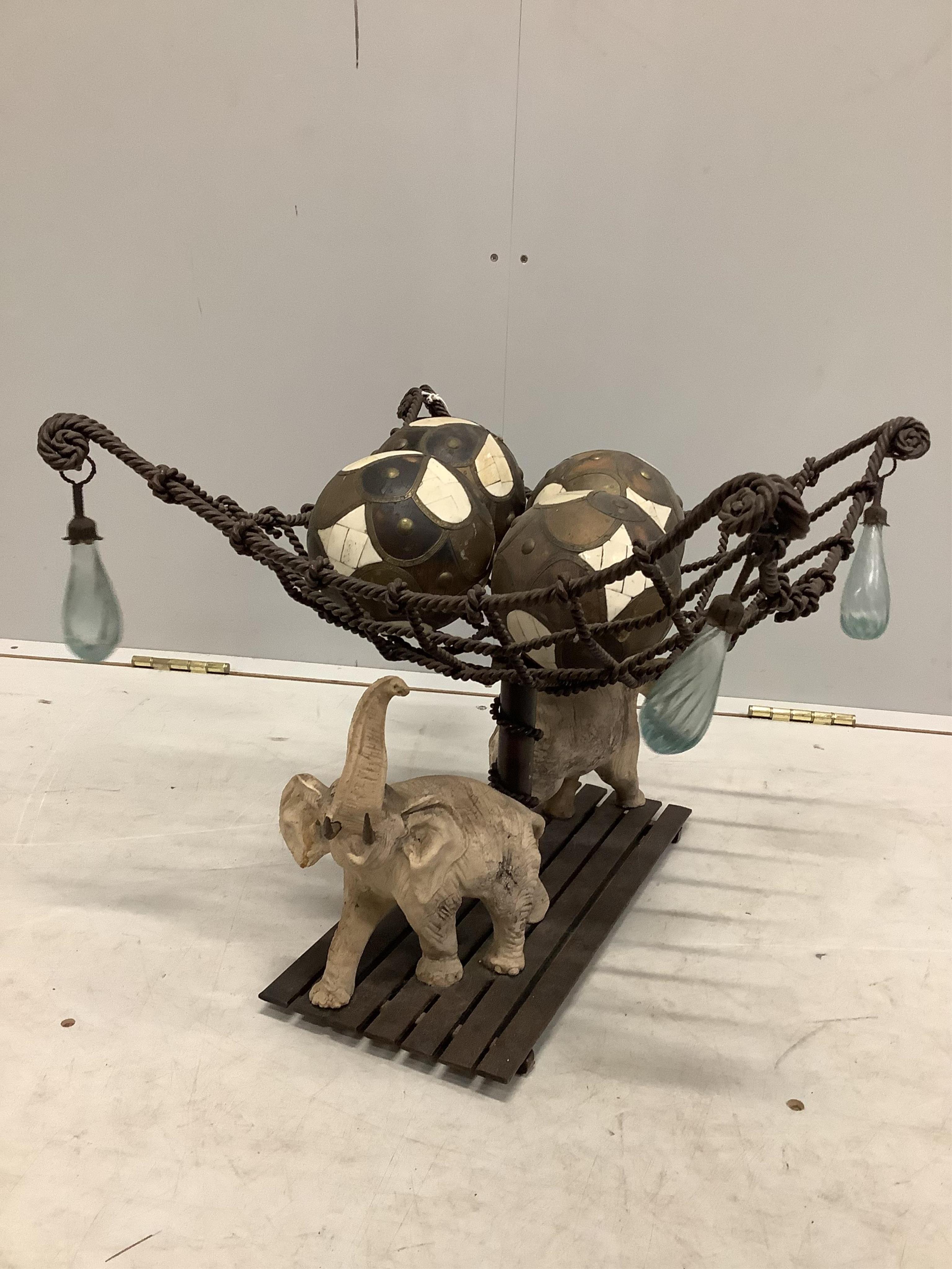 A Contemporary composition elephant and basket centrepiece, width 43cm, height 37cm. Condition - fair